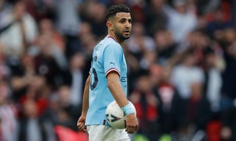 Manchester City's hat-trick hero Riyad Mahrez clutches the match ball after their victory in the Emirates FA Cup Semi Final match between Manchester City and Sheffield United at Wembley Stadium.