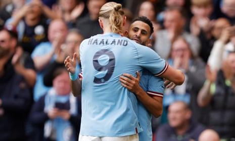 Riyad Mahrez of Manchester City celebrates scoring his side's second goal with teammate Erling Haaland.