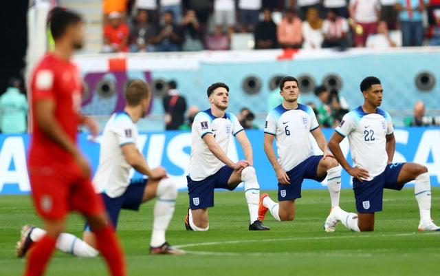 England’s Declan Rice and Harry Maguire take the knee v Iran