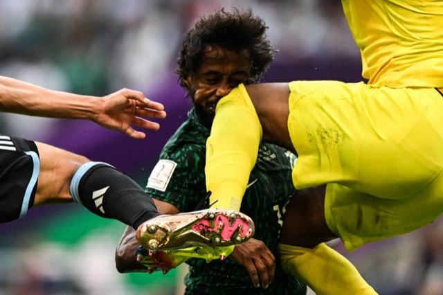 Saudi Arabia’s goalkeeper Mohammed Al-Owais hits Saudi Arabia’s defender Yasser Al-Shahrani in the head during their Qatar 2022 World Cup Group C match v Argentina at the Lusail Stadium