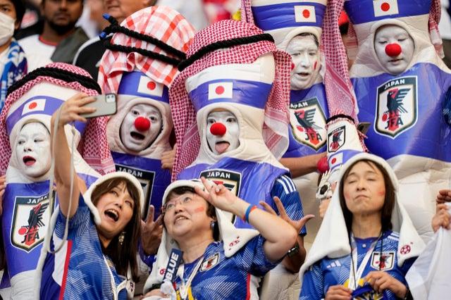 Fans from Japan wait for the start of the World Cup group E soccer match v Germany at the Khalifa International Stadium in Doha, Qatar,