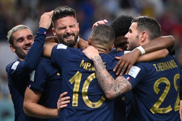 France’s Olivier Giroud celebrates with teammates after he scored during the Qatar 2022 World Cup Group D football match v Australia at the Al-Janoub Stadium in Al-Wakrah, south of Doha 