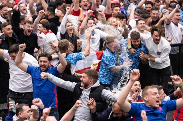 ngland fans cheer at BOXPARK Croydon as they watch a live broadcast of England’s opening group-round match versus Iran 