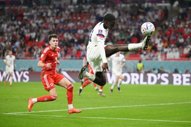 USA’s Timothy Weah of United States controls the ball during the FIFA World Cup Qatar 2022 Group B match v Wales at Ahmad Bin Ali Stadium