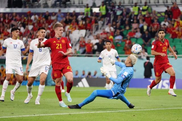 Dani Olmo of Spain scores their team’s first goal past Keylor Navas of Costa Rica during the FIFA World Cup Qatar 2022 Group E match between Spain and Costa Rica at Al Thumama Stadium