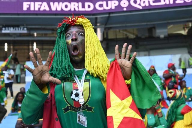A Cameroon fan waits for the start of the Qatar 2022 World Cup Group G l match v Switzerland