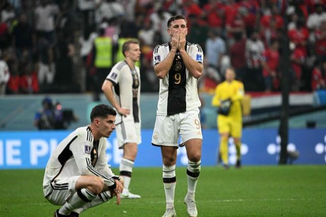 Germany players stand dejected at the end of the Qatar 2022 World Cup Group E campaign and match v Costa Rica 